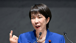 Japan govt approves record budget, including for defence