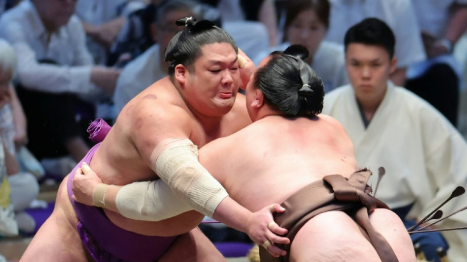 Sumo moves to beat Japan summer heat as temperatures rise