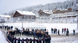 40 white roses: shaken mourners remember Swiss fire victims