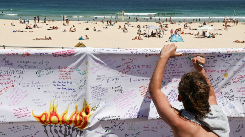 Australia stops in silence for Bondi Beach shooting victims