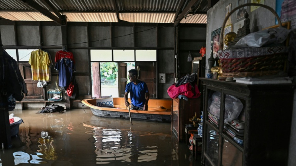 Thais navigate flooded homes and ancient temples by boat